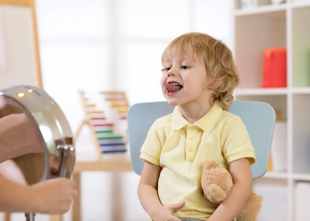 boy sticking out tongue